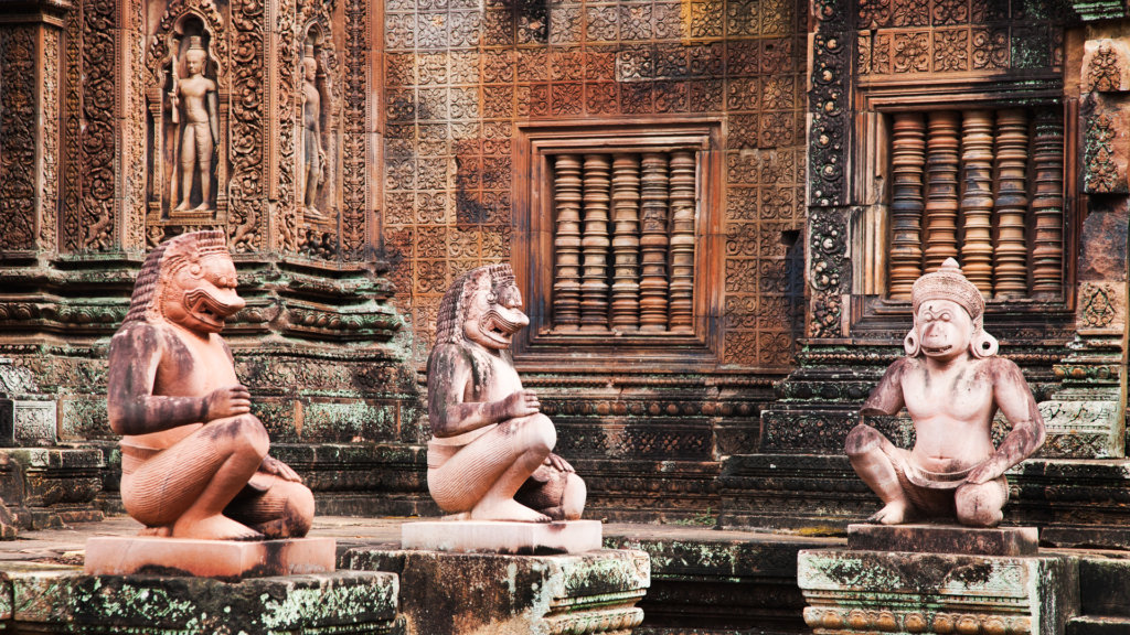 Replica statues guarding Banteay Srei