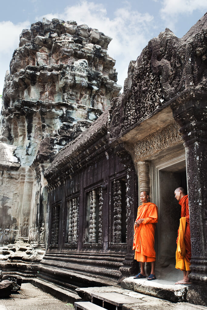 Monks in the upper level of Angkor Wat.